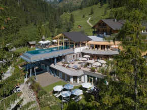 Отель Almwellness-Resort Tuffbad  Санкт-Лоренцен Лезахталь